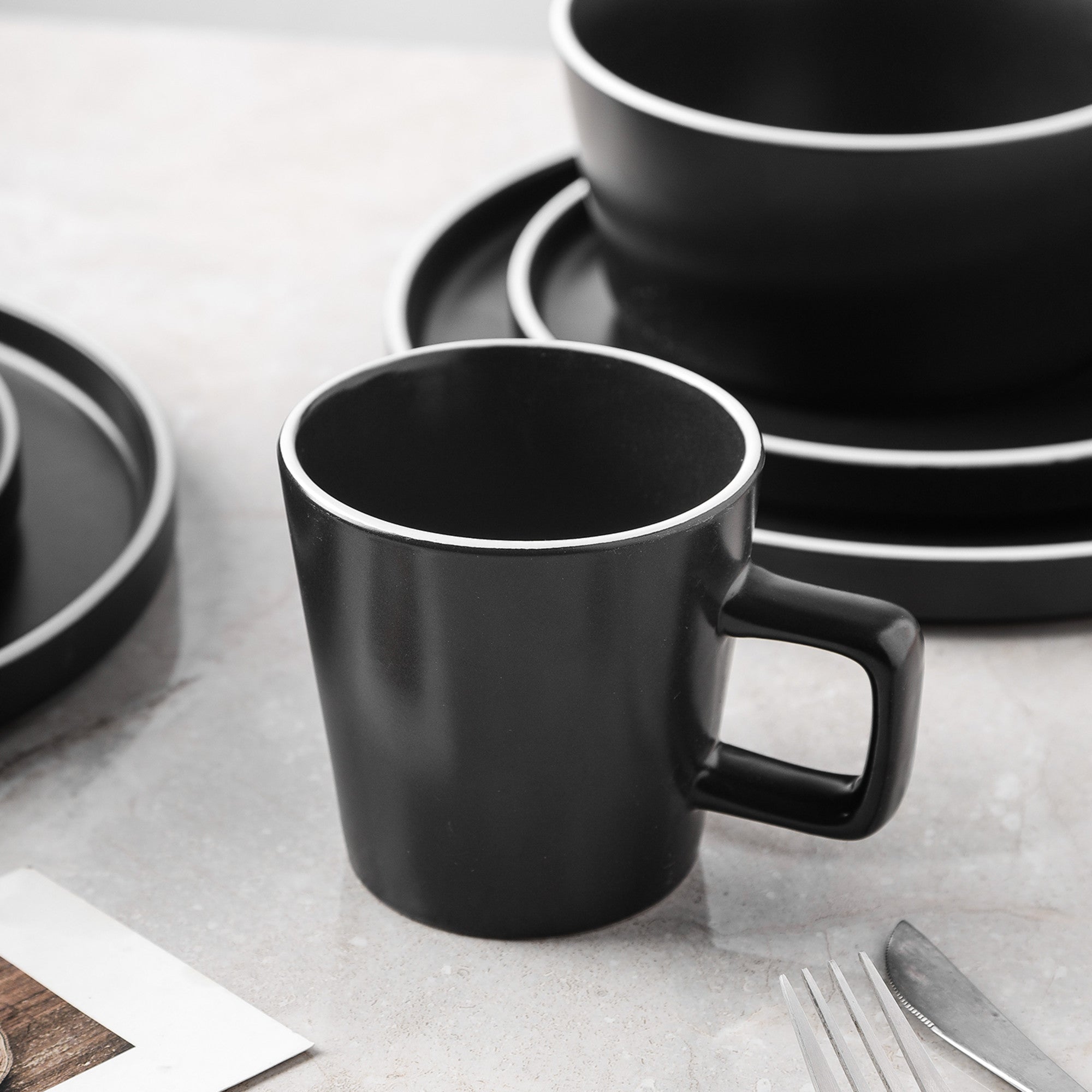 Monxra Stoneware Dinnerware Set - Black Matte, White Rim